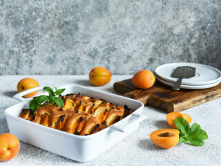 Wall Mural - cake with apricots. Homemade pie with peaches and apricots on the kitchen table.