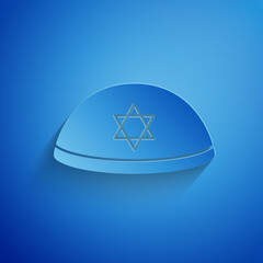 Wall Mural - Paper cut Jewish kippah with star of david icon isolated on blue background. Jewish yarmulke hat. Paper art style. Vector