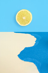 Wall Mural - Creative summer sea scene with a slice of fresh grapefruit against a blue and beige background. Creative summer composition. Minimal nature or food concept.