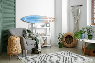 Poster - interior of modern stylish room with surfboard and armchair