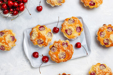 Wall Mural - Homemade muffins with sweet red cherries.