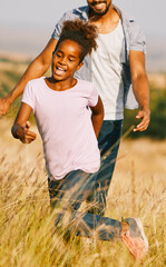 Wall Mural - child daughter family happy mother father running active healthy carefree fun together girl walking cheerful field outdoor natur summer