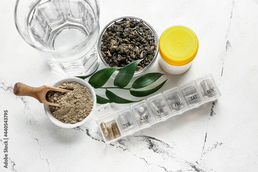 Composition with pills on light background