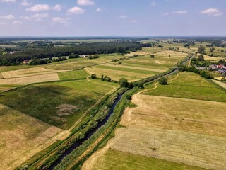 Fields, meadows in rural green areas by the river - top view 