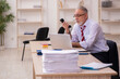 © Elnur - Old businessman employee sitting in the office
