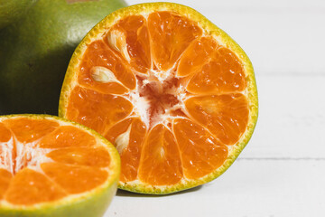 Orange on white wooden background for fruit and eating concept