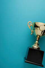 golden trophy on blue background