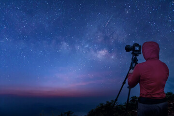 Canvas Print - photographer taking thailand travel milky way photography. woman photographer shooting with tripod a