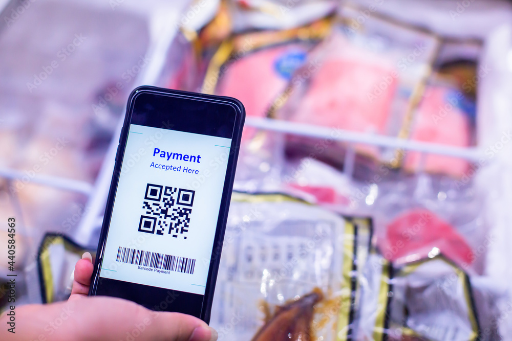 Selective focus to QR code tag on smartphone with blurry meat products ...