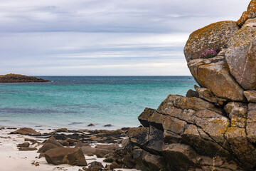 Rock on a white sand beach in Ile de Batz (Roscoff), Finistere, Brittany, France