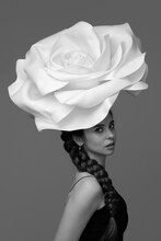 Portrait Fashion Black And White Photo Of A Woman With A Big White Rose On Her Head