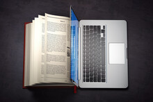 Online Library Or E-learning Concept. Open Laptop And Book Compilation.