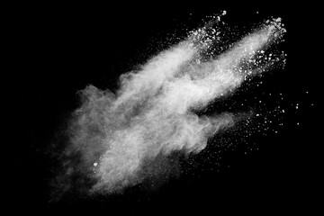 Wall Mural - White powder explosion cloud against black background.White dust particles splash.