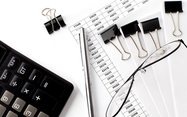 Poster - Charts and papers with calculator and glasses. Business concept