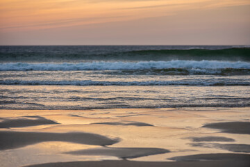 Wall Mural - absolutely stunning landscape images of holywell bay beach in cornwall uk during golden hojur sunset