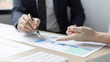 © Puwasit Inyavileart - Brainstorm team, Marketers and financial accountants are discussing and analyzing charts to plan strategies to meet customer needs, Team meetings or business consulting.