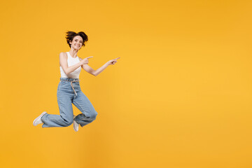 Wall Mural - full length young fun happy amazed woman 20s with bob haircut wearing white tank top shirt jumping h