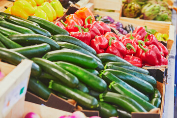 Wall Mural - Fresh organic bell peppers and zuccinis on market in Paris, France