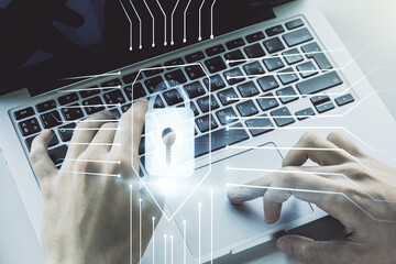 Poster - Double exposure of creative lock hologram with chip and hands typing on laptop on background. Information security concept