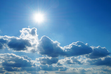 clear sun in the sky above rain clouds