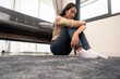 © PK Studio - Young woman lying at home living room couch feeling sad tired and worried suffering depression in mental health