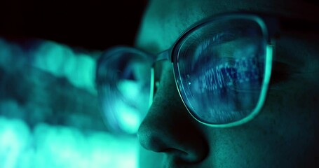 Closeup of Young Adult Female Wearing Reflective Eye Glasses Analyzing Cyber Security Code Data Working Night Concentrating Computer Screen | Financial Virus Hacker Women Dark Programmer Crypto BTC 4K