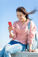 Wall Mural - asian girl use smartphone