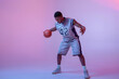© Nomad_Soul - Basketball player practicing with ball in studio
