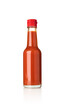 Mexican chili sauce in glass bottle on isolated white background 