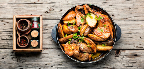 Sticker - Roast chicken leg with potatoes on iron cast pan