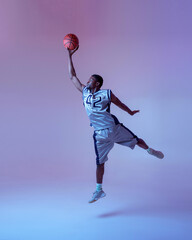 Basketball player with ball, jump in action