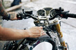 © DragonImages - Hands of man wiping off cleaning foam from his motorcycle with soft cloth