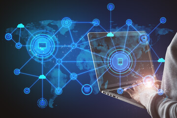 Poster - Hand using laptop with abstract computer map and digital icons hologram on blue background. Cloud computing and data storage concept.