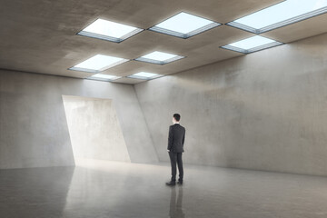 Aufkleber - Pensive businessman in concrete office room interior standing at success door. New way, start up and opportunity concept.