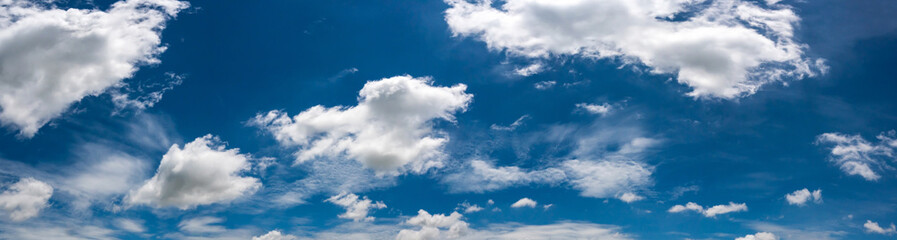 Wall Mural - panorama sunlight with blue sky on dark background.vivid sky on white clouds.