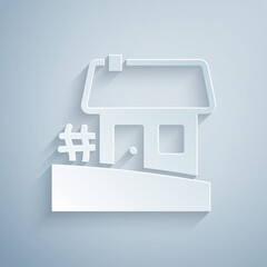 Sticker - Paper cut Old Ukrainian house hut icon isolated on grey background. Traditional village house. Paper art style. Vector