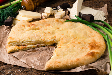 Canvas Print - Ossetian Pie with Cheese on Parchment