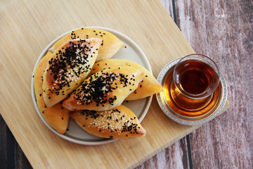 traditional eastern Turkish baked pies with black cumin sprinkle