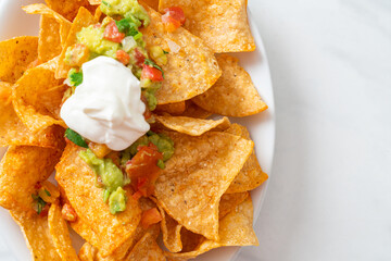 Sticker - nachos tortilla chips with jalapeno, guacamole, tomatoes salsa and dip