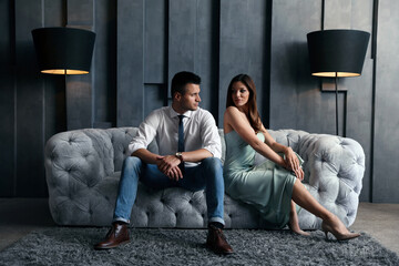 Wall Mural - Beautiful couple in stylish living room. Luxury lifestyle