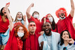 © Xavier Lorenzo - Multiracial sports fans in protective face masks screaming while supporting their team at stadium -  Coronavirus spread prevention  and live sports new normality concept