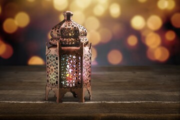 Poster - Ornamental Arabic lantern glowing at night. Festive Muslim holy month Ramadan Kareem.