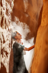 Wall Mural - Beautiful woman resting in the desert