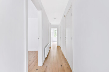 bright white walls and interior details of long corridor in modern house