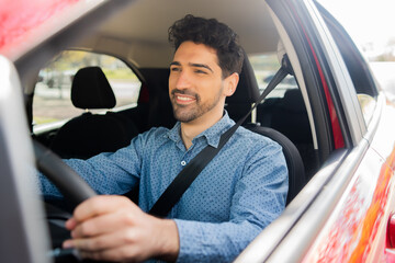 Man driving his car on way to work.