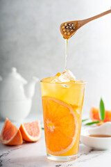 Wall Mural - Grapefruit honey jasmine tea served cold with ice