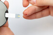 © vitalis83 - Taking blood from finger for sugar level medical test