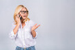 Photo portrait of shocked amazed surprised senior mature woman holding mobile phone seeing crazy discounts wearing casual isolated on grey white background.