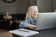 © Yakobchuk Olena - Girl having distant education with teacher using laptop