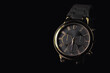 Luxury watch on a black background, copy space available.